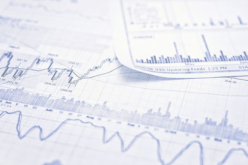 Closeup of financial graphs and trend charts.