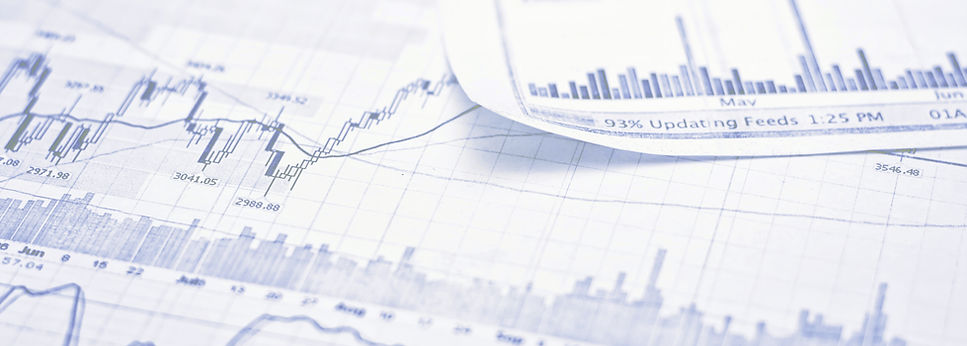 Image of data charts laid out on a table to review.