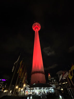 Red illuminated tower at night