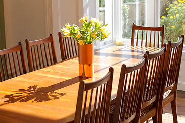 Sunlight floods into the formal Dining Room seating 10 at Myrtle House Penzance