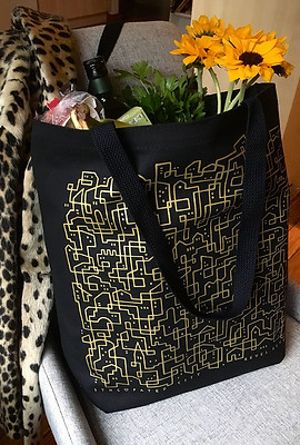 black canvas grocery tote with gold printed city pattern