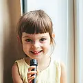 little-girl-holding-a-microphone-2022-11-02-21-52-13-utc.webp