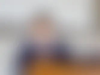 Confident student speaking at a podium during a public speaking or debate event