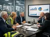 Manufacturing leaders reviewing hiring strategy in a modern office setting