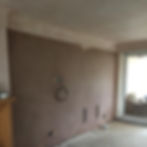 Living room with coved ceiling plastered