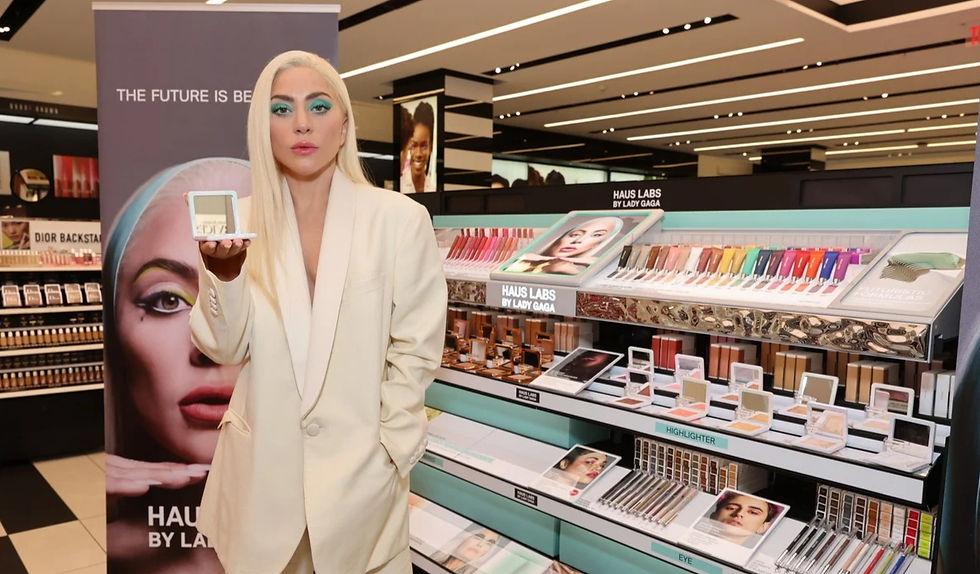 High angle view of a Sephora store display featuring Hauslabs Tri-Clone Foundation bottles and testers