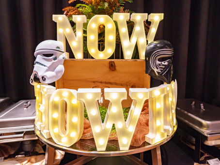 Emcee Singapore - The illuminated "NOW SHOWING" sign adorned with iconic Star Wars helmets at the Pullman Hillstreet Dinner & Dance 2025.