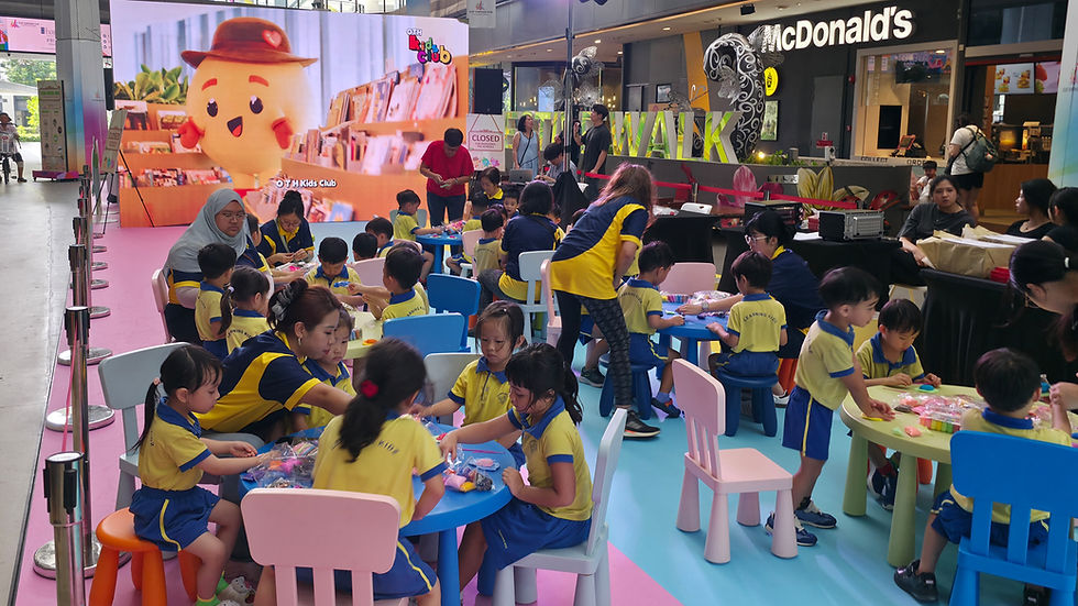 Emcee - Children actively participate in a creative workshop at a lively kids' club event, filled with colorful activities and learning experiences.