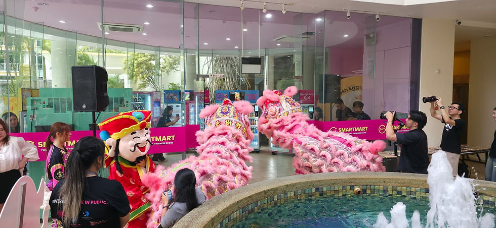 Emcee Singapore - The colorful and lively lion dance performance captivated a crowd at the 24/7 SmartMart as photographers captured the exciting scene.