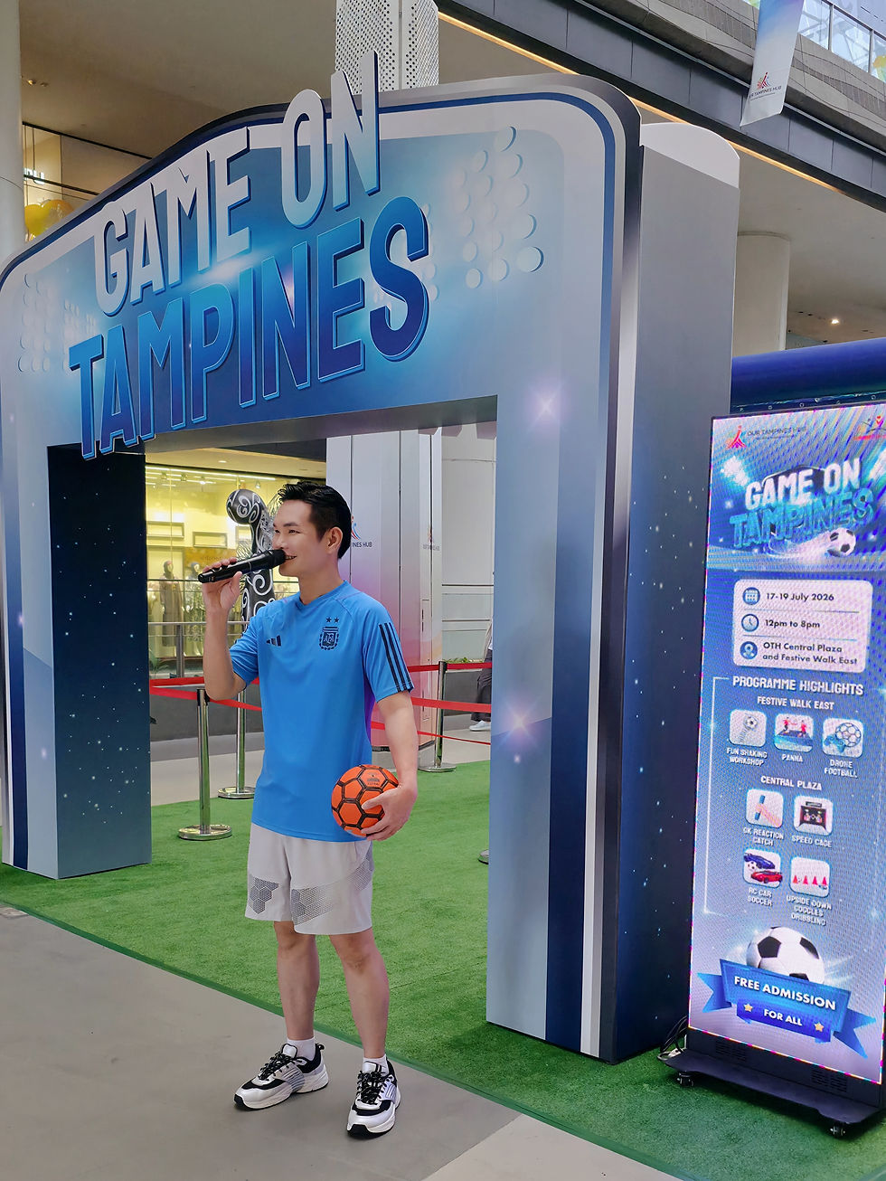 Emcee Singapore Ivan engages the crowd at the "Game On Tampines" event, showcasing sports activities and entertainment for all ages at Our Tampines Hub.