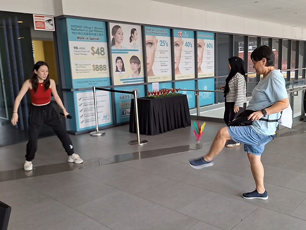 Emcee Singapore - Emcee Shirleen competing with our lovely participant in a friendly chapteh match.