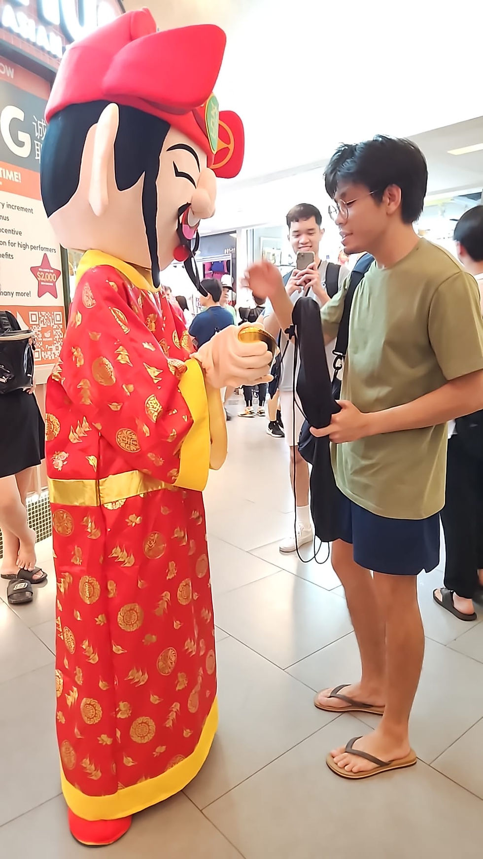 Emcee Singapore - He wants the ingot from our god of wealth.