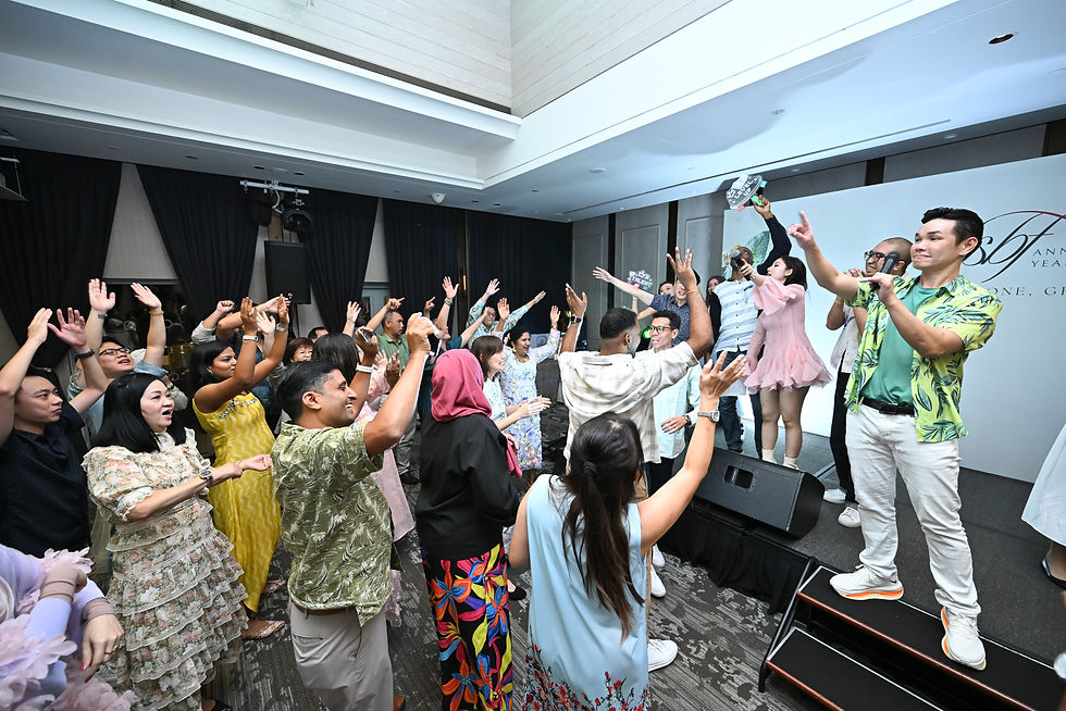 Emcee Singapore - Our host dressed in colourful outfit, energized the audience with music and dance before leading into the finale.