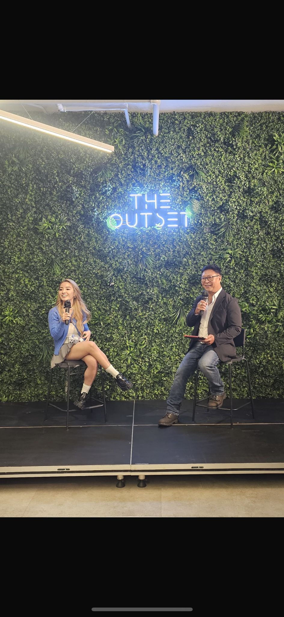 Emcee - Emcee and Naomi engage in a lively interview discussion on stage at "The Outset,"