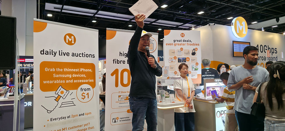 Emcee - Emcee Sebastian conducting the bidding during auction at M1 booth.