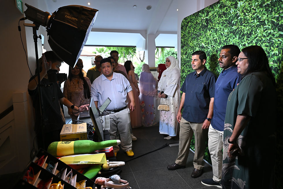 Emcee SIngapore - A group of guests at the photo booth having fun while taking a group shot.