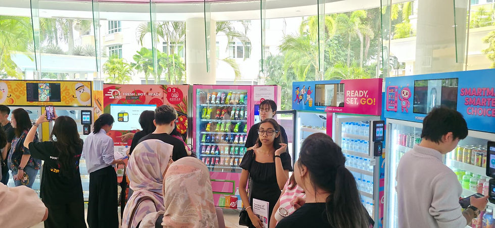 Emcee Singapore - Shoppers explored the vibrant 24/7 vending machines selling various drinks and snacks during the grand opening.