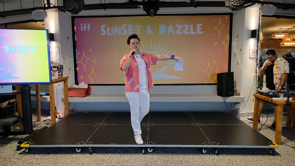 Emcee - Our host enthusiastically welcomed the IFF staff at the Dinner & Dance themed "Sunset & Dazzle".