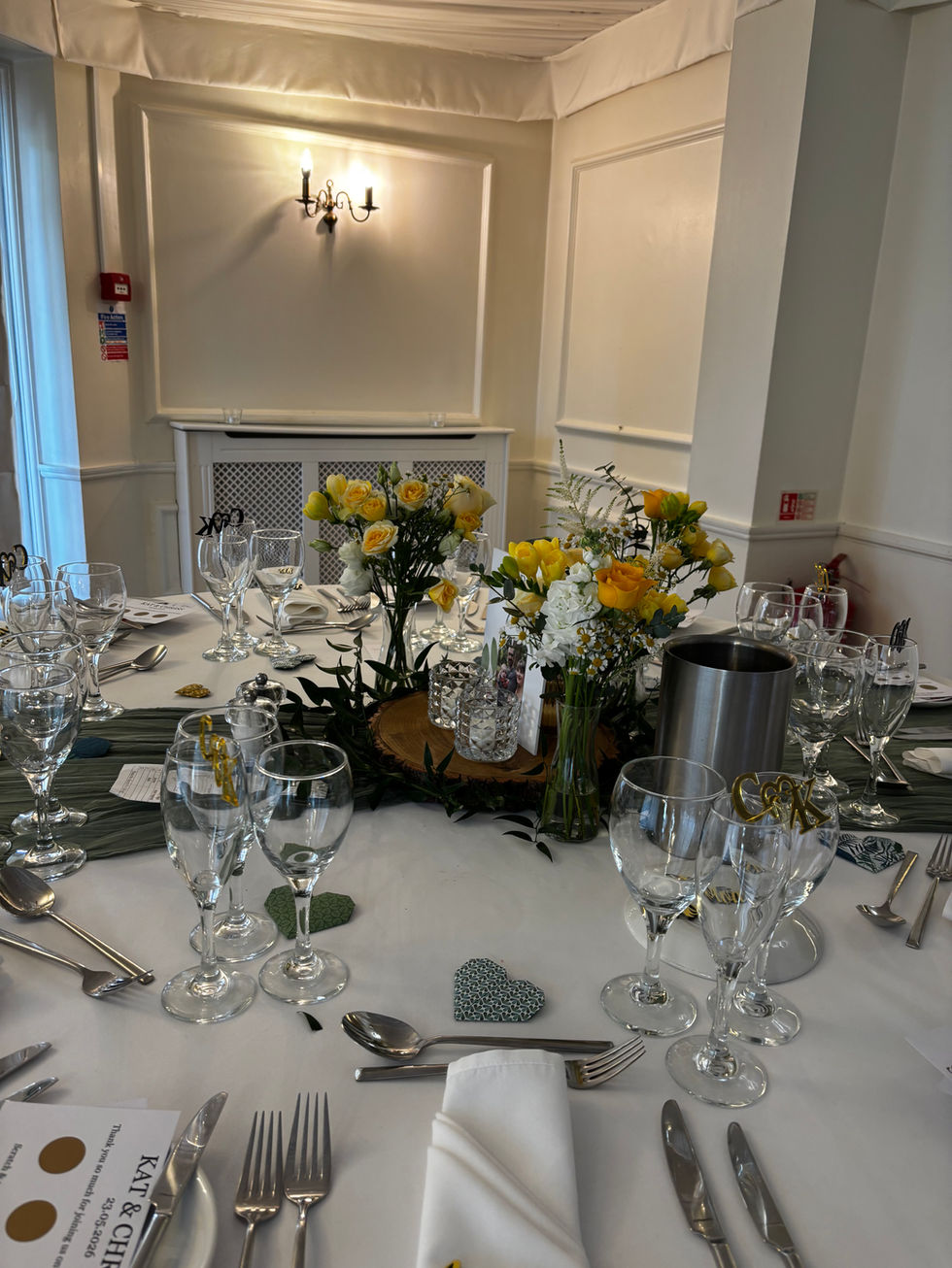 Elegant table setting with flowers and glassware.