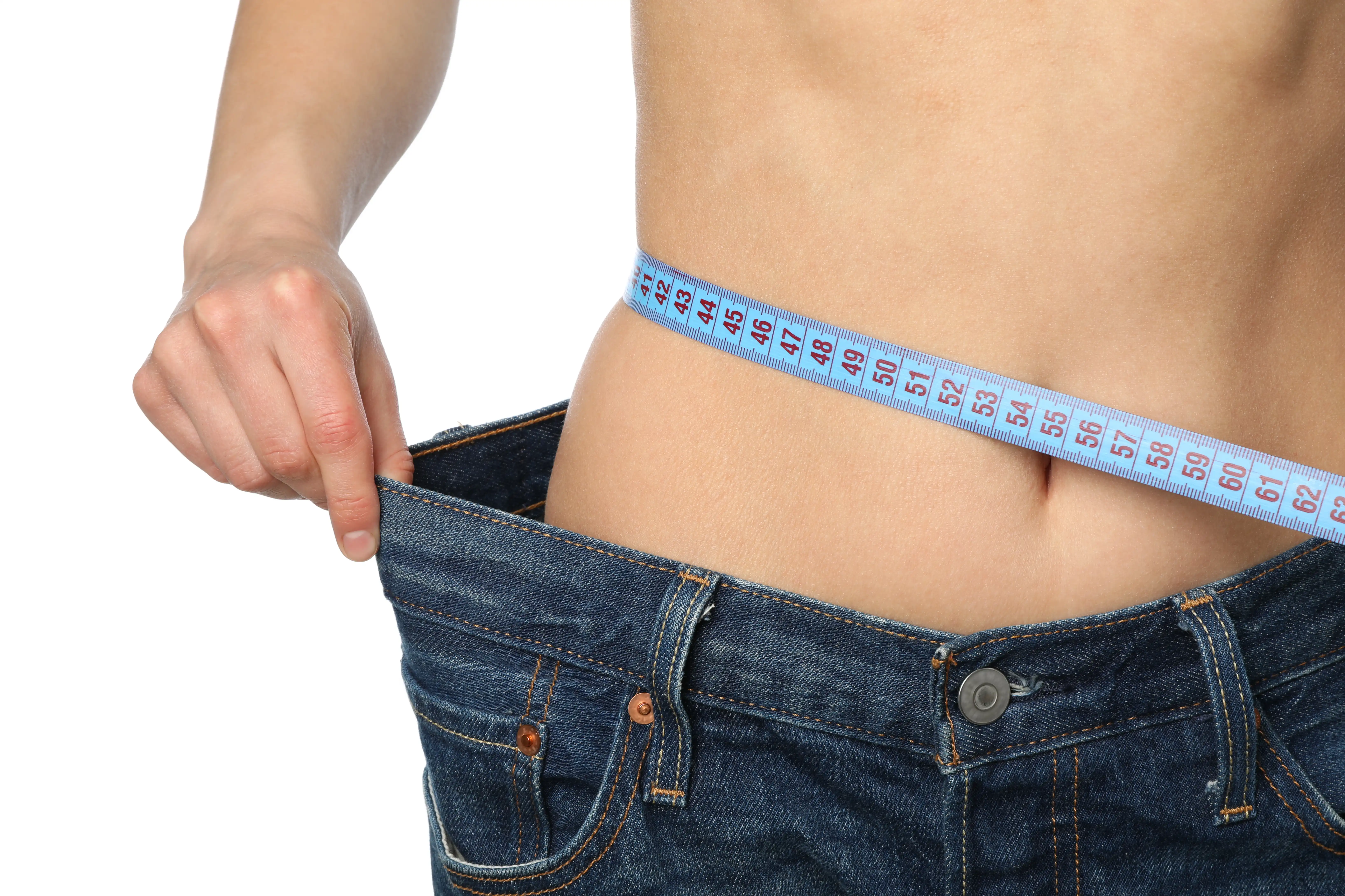 woman-in-jeans-measuring-her-waist