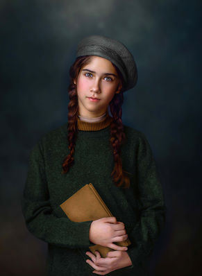 A young girl in a beret holds a book while staring at the camera in a fine art portrait, capturing a timeless and introspective moment.