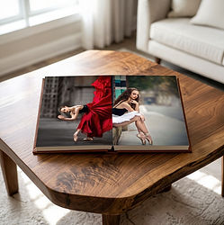 Senior dance photo album on a wooden table.