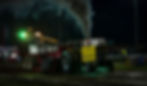 Tractor pulling a sled and smoke coming out from the exhaust