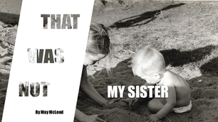 TWO SMALL CHILDREN PLAYING IN THE SAND