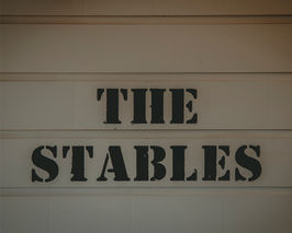 The Stables sign at St Leonards Vineyard Cottages in Marlborough, New Zealand