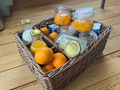 Hamper of breakfast items at St Leonards Vineyard Cottages in Marlborough, New Zealand