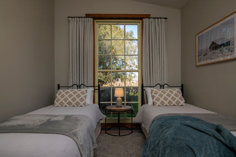 Two King Single beds in second bedroom in The Woolshed at St Leonards Vineyard Cottages boutique accommodation in Marlborough, New Zealand