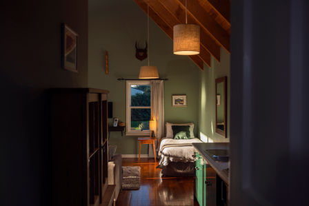 View looking through kitchenette to King Single bed in the Winemakers Cottage at St Leonards Vineyard Cottages boutique accommodation in Blenheim, New Zealand