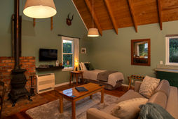 Spacious lounge in the Winemaker's Cottage at St Leonards Vineyard Cottages accommodation in Marlborough, New Zealand