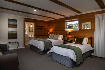 Queen bed and King Single bed in the Shearers Quarters cottage at St Leonards Vineyard Cottages boutique accommodation in Marlborough, New Zealand