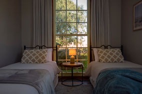 Two King Single beds in The Woolshed accommodation at St Leonards Vineyard Cottages in Marlborough, New Zealand