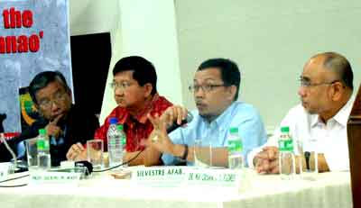 Dean Julkipli Wadi (second from right) responds to question at open forum while Gen. (ret.) Rodolfo Garcia, CenPEG Fellow Prof. Roland Simbulan, and former Secretary Silvestre Afable, Jr. listen. (CenPEG Photo)
