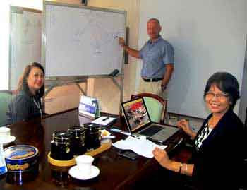 Norwegian Training Center's Capt. Eric Blom (middle) briefs Mariner System's Nimpa Jimenez and CenPEG's Evi L. Jimenez, Nov. 19, 2013.