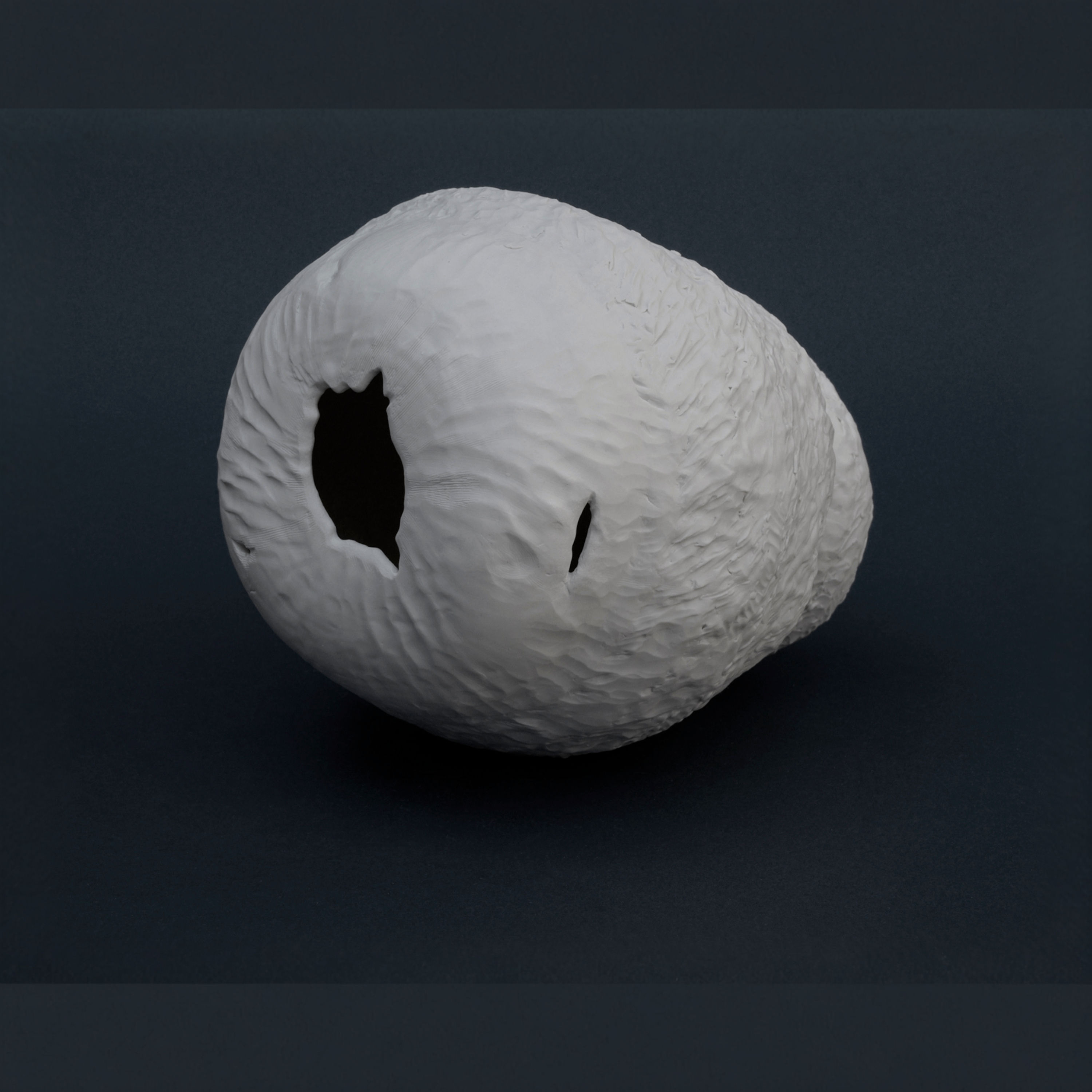 Italian handmade porcelain sculpture by Etra Masi, organic textured vessel crafted in Faenza, part of the Skin ceramic series