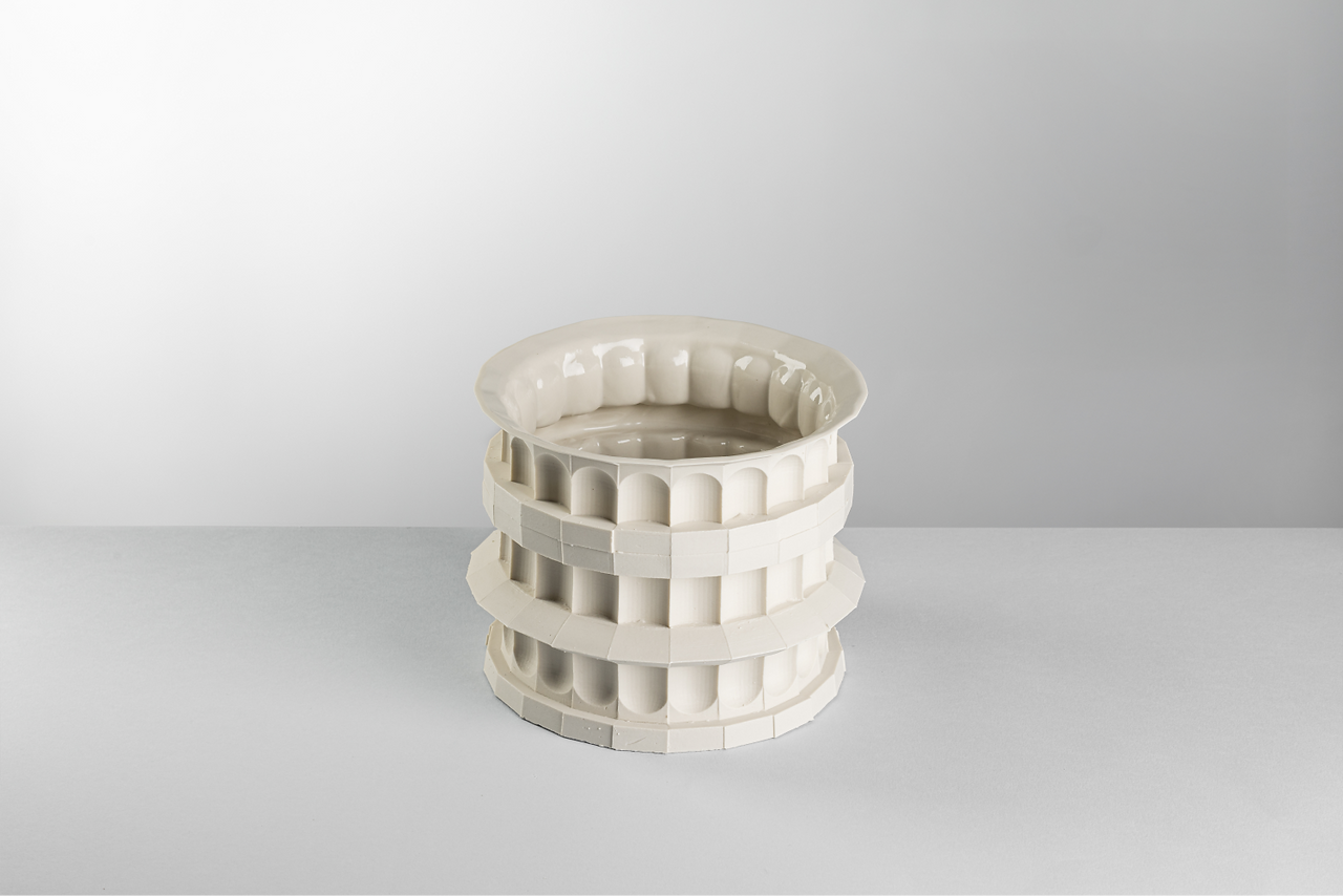 Modular vessel in liquid porcelain by Claudio Campana, produced through slip casting and interchangeable mould elements.