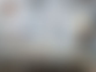 Claudio Campana working in his ceramic studio in Italy, surrounded by moulds, tools, and works in progress.