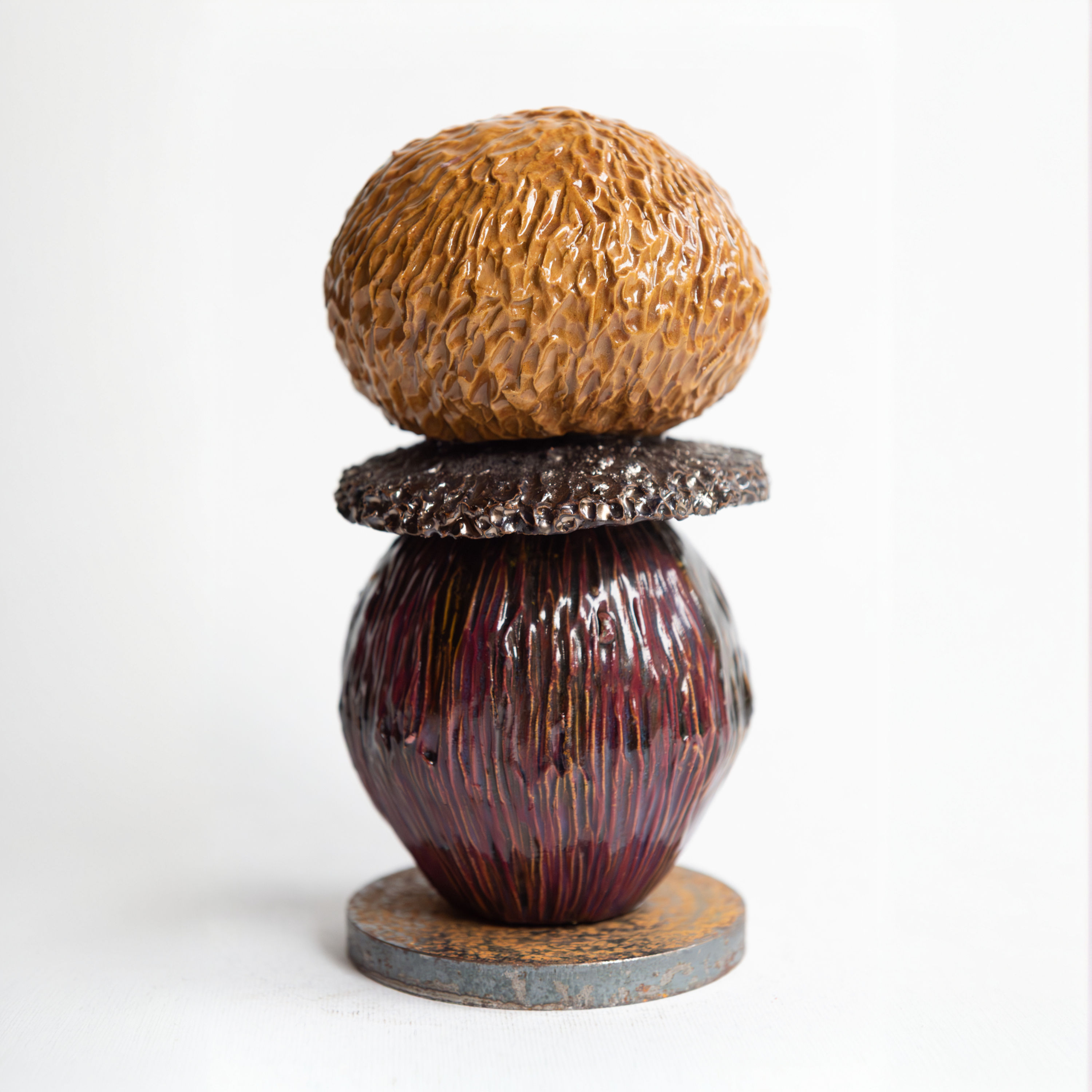 Italian handmade ceramic sculpture Funghi #6 by Lucia Zamberletti, small textured piece with warm ochre and plum glazes.