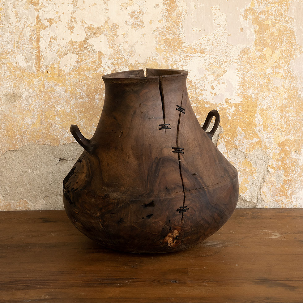 Handcrafted walnut wood vase with integrated side handles, inspired by ancient Greek design, side view.