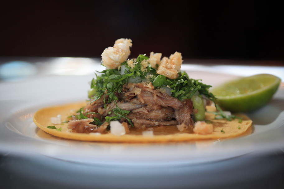 Tacos de Carnitas con Salsa Verde Cruda, Chicharron, Onion, Cilantro