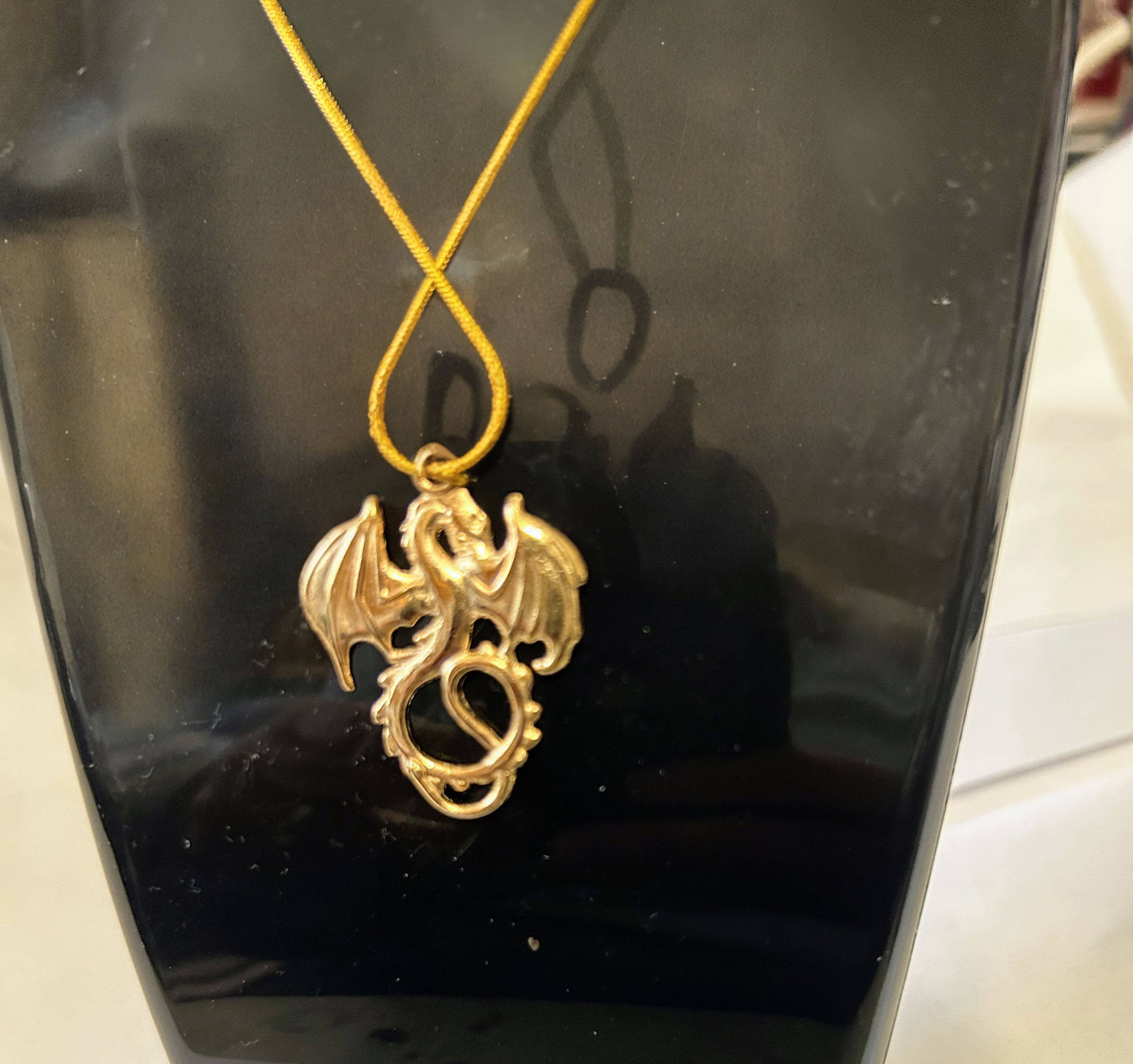 Gold tone metal dragon pendant necklace