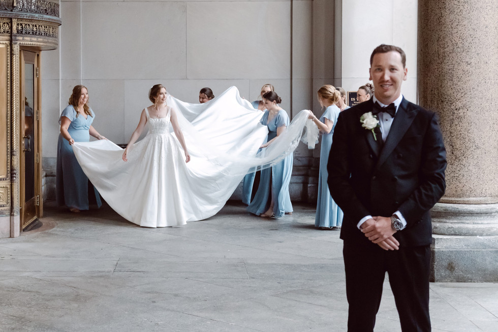 Bride getting ready for first look Cadillac Square Detroit