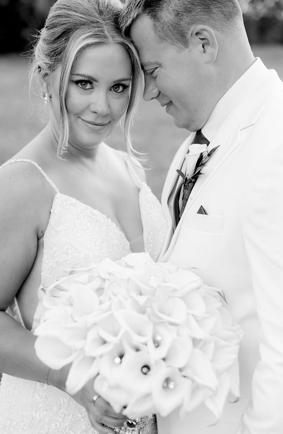 Golden hour sunset wedding portraits in open field in Michigan