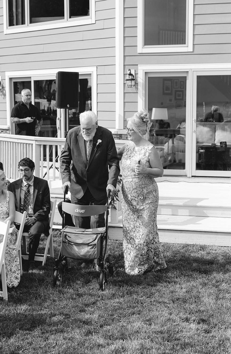 Emotional moment of grandfather walking down the aisle at wedding ceremony