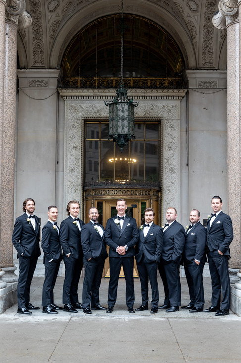 Groomsmen in black suites and tuxedo's Detroit wedding