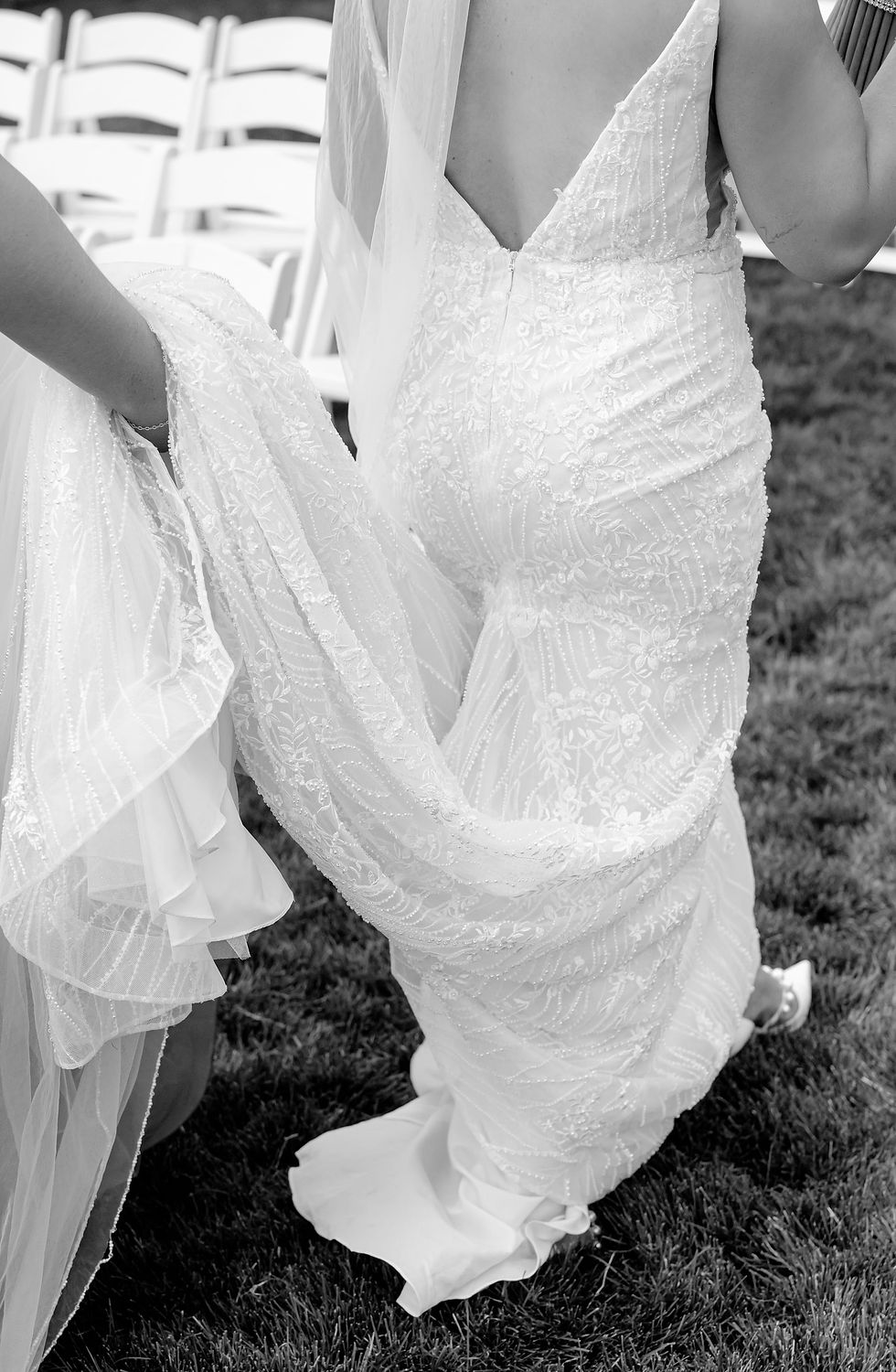 Black and white bride walking to isle