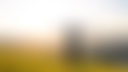 Man with arms outstretched stands on a grassy hill at sunrise, overlooking mountains. Sky is bright; mood is joyful. "CZ" logo in corner. Craig Zuber's Weekly Edge